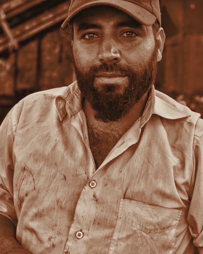 Sam Ozturk, owner of Halloway Heating, photographed in his work shirt