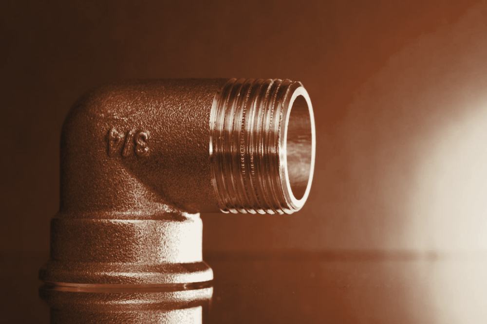 Close up of a brass pipe fitting on a heating system